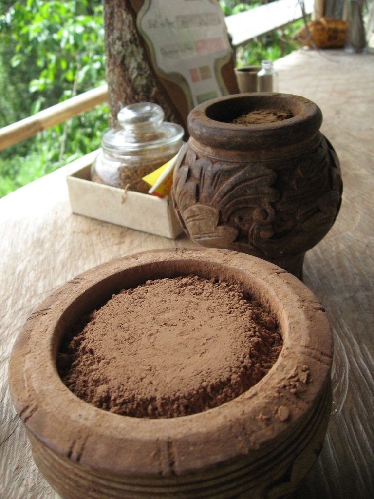 ground cacao prepared on table in jungle